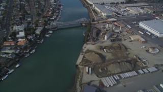 DFKSF06_002 - 5K aerial stock footage of flying over Oakland Estuary to approach High Street Bridge, Oakland, California
