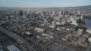 DFKSF06_009 - 5K stock footage aerial video tilt from I-880 freeway to reveal Downtown Oakland, California