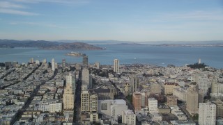 DFKSF06_050 - 5K aerial stock footage pan across Nob Hill, Russian Hill apartment and office buildings to reveal Coit Tower, North Beach, San Francisco, California
