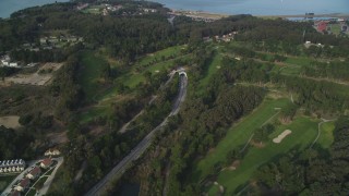 DFKSF06_082 - 5K aerial stock footage fly over highway to MacArthur Tunnel and The Presidio Golf Course, San Francisco, California