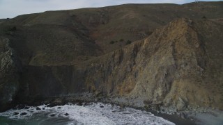 DFKSF06_107 - 5K aerial stock footage approach and ascend over Muir Beach coastal cliffs, Marin County, California