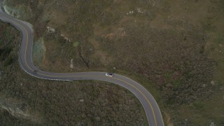 DFKSF06_110 - 5K stock footage aerial video track silver convertible on Highway 1, Marin County, California