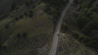 DFKSF06_112 - 5K stock footage aerial video of tracking a silver convertible traveling on Highway 1, Marin County, California