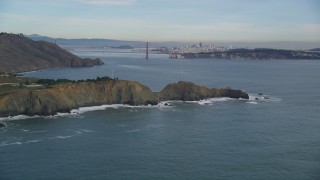DFKSF06_156 - 5K aerial stock footage flyby the Marin Headlands coastal cliffs and famous Golden Gate Bridge, Marin County, California