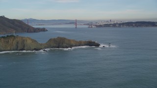 DFKSF06_157 - 5K stock footage aerial video of a view of the Marin Headlands coastal cliffs and iconic Golden Gate Bridge, Marin County, California