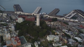 DFKSF06_175 - 5K aerial stock footage tilt from North Beach apartments, reveal Coit Tower, San Francisco, California