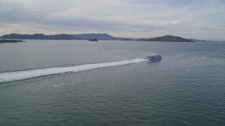 DFKSF06_177 - 5K aerial stock footage of tracking a ferry cruising on the San Francisco Bay, California
