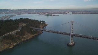 DFKSF06_182 - 5K aerial stock footage approach the Bay Bridge and tilt to Yerba Buena Island, San Francisco, California