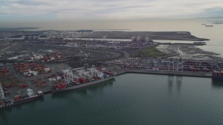 DFKSF06_186 - 5K aerial stock footage of flying by the Port of Oakland, California