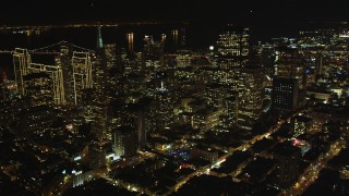 DFKSF07_015 - 5K aerial stock footage of tilting from Chinatown to reveal skyscrapers in Downtown San Francisco, California, night