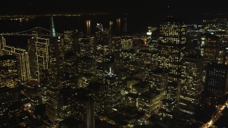 DFKSF07_016 - 5K aerial stock footage flyby Transamerica Pyramid and over skyscrapers, Downtown San Francisco, California, night