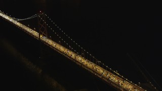 DFKSF07_025 - 5K aerial stock footage approach and pan across heavy Bay Bridge traffic, Downtown San Francisco, California, night