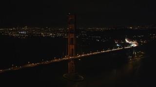 DFKSF07_038 - 5K aerial stock footage of flying by the iconic Golden Gate Bridge, San Francisco, California, night