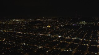 DFKSF07_043 - 5K aerial stock footage approach St. Ignatius Church, Inner Richmond District, San Francisco, California, night