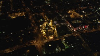 DFKSF07_046 - 5K aerial stock footage orbit St. Ignatius Church in the Inner Richmond District, San Francisco, California, night