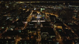 DFKSF07_051 - 5K aerial stock footage fly over Fulton Street, tilt to reveal city hall, Civic Center, San Francisco, California, night