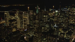 DFKSF07_059 - 5K aerial stock footage of tilting from Columbus Ave to reveal skyscrapers in Downtown San Francisco, California, night