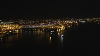 DFKSF07_076 - 5K aerial stock footage of panning across the Port of Oakland, California, night