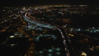 DFKSF07_085 - 5K aerial stock footage video of following I-880 freeway, Oakland, California, night