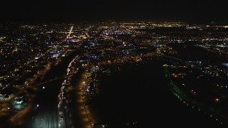 DFKSF07_086 - 5K stock footage aerial video of flying over the I-880 freeway in Oakland, California, night