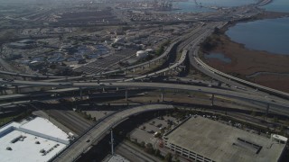 DFKSF08_002 - 5K aerial stock footage of flying by the MacArthur Maze freeway interchange, Oakland, California