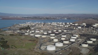 DFKSF08_023 - 5K aerial stock footage of flying by the ConocoPhillips Oil Refinery, Rodeo, California