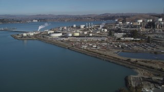 DFKSF08_024 - 5K aerial stock footage of flying by ConocoPhillips Oil Refinery, seen from San Pablo Bay, Rodeo, California
