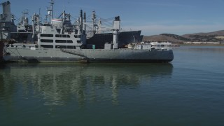 DFKSF08_054 - 5K aerial stock footage of flying by warships from the National Defense Reserve Fleet, Suisun Bay, California
