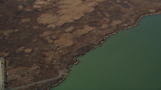 DFKSF08_070 - 5K aerial stock footage of flying away from Belloma Slough, Suisun Bay, California