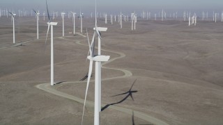 DFKSF08_080 - 5K aerial stock footage of flying by windmills at the Shiloh Wind Power Plant, Montezuma Hills, California