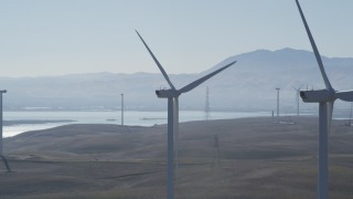 DFKSF08_089 - 5K aerial stock footage of flying by tops of windmills at Shiloh Wind Power Plant, Montezuma Hills, California