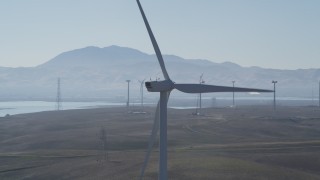 DFKSF08_090 - 5K aerial stock footage fly by top of windmill, Shiloh Wind Power Plant, Montezuma Hills, California
