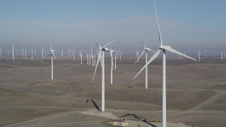 DFKSF08_094 - 5K aerial stock footage flyby windmills while zooming out at Shiloh Wind Power Plant, Montezuma Hills, California