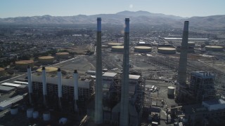 DFKSF08_100 - 5K stock footage aerial video of orbiting a power plant's smoke stacks, Pittsburg, California