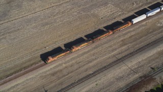 DFKSF08_105 - 5K aerial stock footage of tracking a train passing through Pittsburg, California