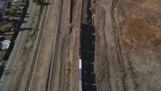 DFKSF08_107 - 5K aerial stock footage of tracking a train traveling through Pittsburg, California