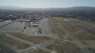 DFKSF08_113 - 5K aerial stock footage video approach parked airplanes at Buchanan Field Airport, Concord, California