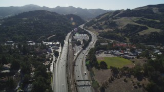 DFKSF09_006 - 5K aerial stock footage fly over Highway 24 freeway to approach BART parking lots, Orinda, California