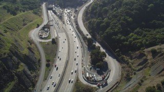 DFKSF09_009 - 5K aerial stock footage of Highway 24 freeway, revealing Caldecott Tunnel, Orinda, California