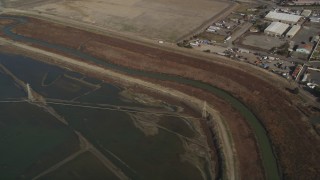 DFKSF11_002 - 5K aerial stock footage flyby power lines and marshland, reveal water treatment plant, Union City, California