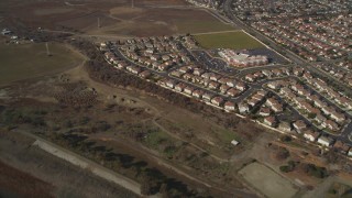 DFKSF11_003 - 5K aerial stock footage of flying away from suburban tract homes, Union City, California