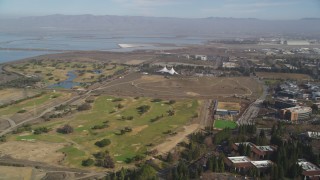 DFKSF11_018 - 5K aerial stock footage pan from golf course to reveal Googleplex office buildings, Mountain View, California