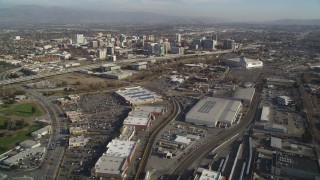 DFKSF12_001 - 5K stock footage aerial video fly over train tracks and yard, tilt to reveal Downtown San Jose, California