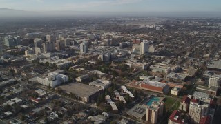 DFKSF12_002 - 5K aerial stock footage of flying by San Jose State University and Downtown San Jose, California