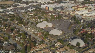 DFKSF12_010 - 5K aerial stock footage of shopping center, suburban homes, reveal Winchester Mystery House, San Jose, California