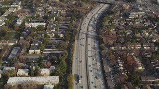 DFKSF12_011 - 5K aerial stock footage of a reverse view of I-280 freeway with light traffic, San Jose, California