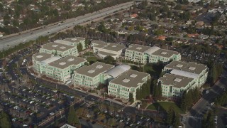 DFKSF12_013 - 5K aerial stock footage of orbiting Apple Headquarters office buildings, Cupertino, California