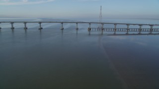 DFKSF12_033 - 5K aerial stock footage of approaching Dumbarton Bridge spanning San Francisco Bay, California