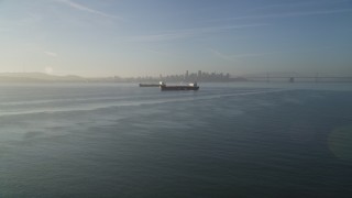 DFKSF13_001 - 5K aerial stock footage of approaching oil tankers in San Francisco Bay, San Francisco, California