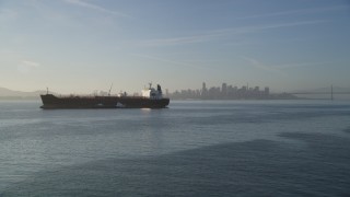 DFKSF13_003 - 5K aerial stock footage of an approach to an oil tanker on San Francisco Bay, San Francisco, California